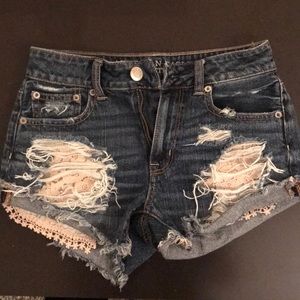 Ripped hi-rise “Festival” denim jean shorts